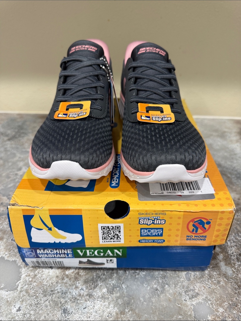 Skechers Women’s Black and Pink Slip-On Knit Sneakers